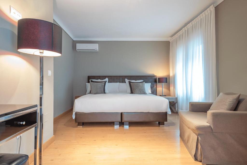 Postel nebo postele na pokoji v ubytování Hostal Parque Ibiza