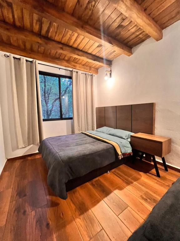 Postel nebo postele na pokoji v ubytování Cabaña Luna Encantada