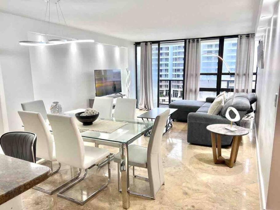 a living room with a table and a couch at 2BD Close to views Sky-Rise 14 in Miami