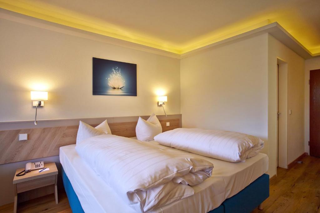Postel nebo postele na pokoji v ubytování Hotel Schloss Berg