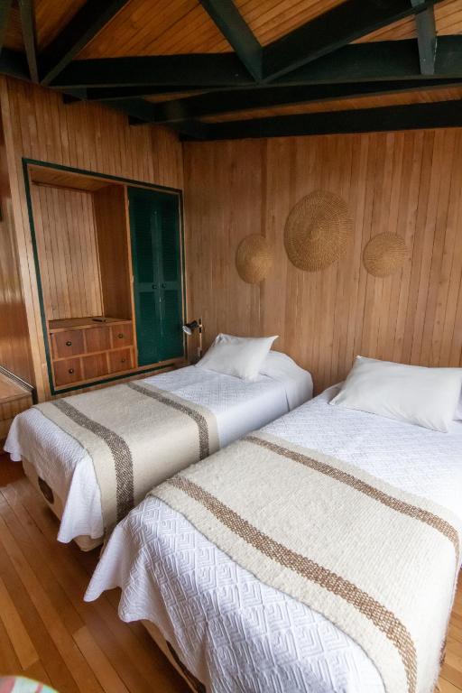 Postel nebo postele na pokoji v ubytování Hotel Unicornio Azul