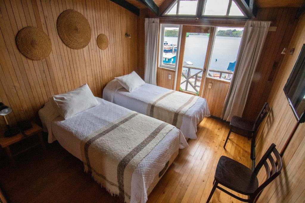 Postel nebo postele na pokoji v ubytování Hotel Unicornio Azul