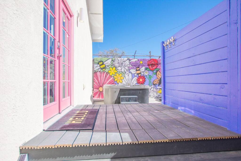 a mural on the side of a building with a purple door at Bohemian Chic an Eclectic Escape-Hot Tub-Pet Friendly-No Pet Fees! in Albuquerque