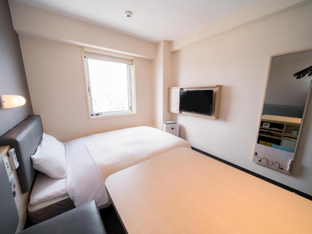 TV a/nebo společenská místnost v ubytování Super Hotel Yamagataeki Nishiguchi Hot Spring