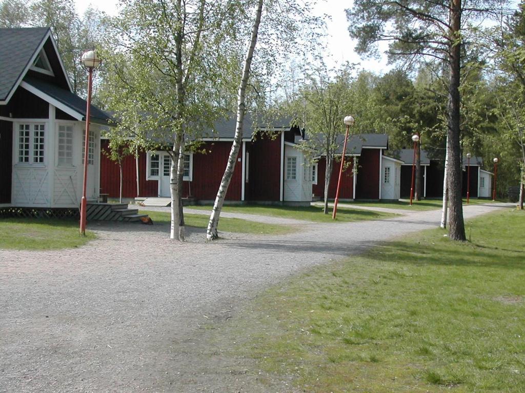 a row of houses with trees in front of them at Villa Elba in Kokkola