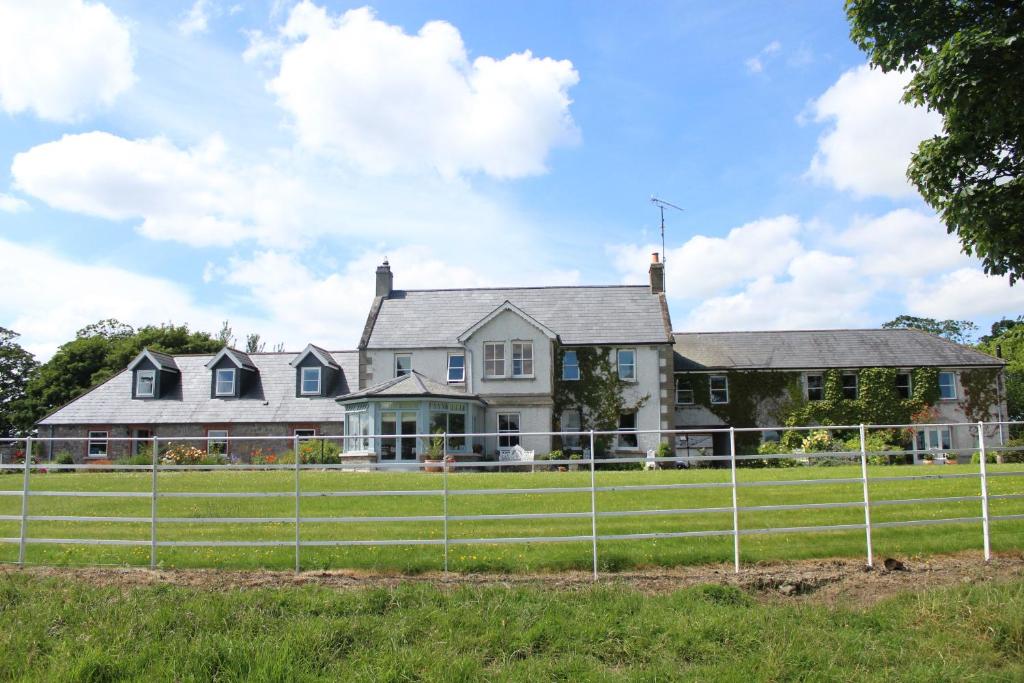 a house with a fence in front of it at Boyne View House in Trim