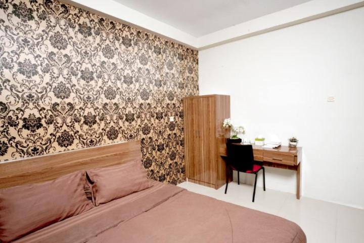 Ένα ή περισσότερα κρεβάτια σε δωμάτιο στο DPARAGON SETURAN 2