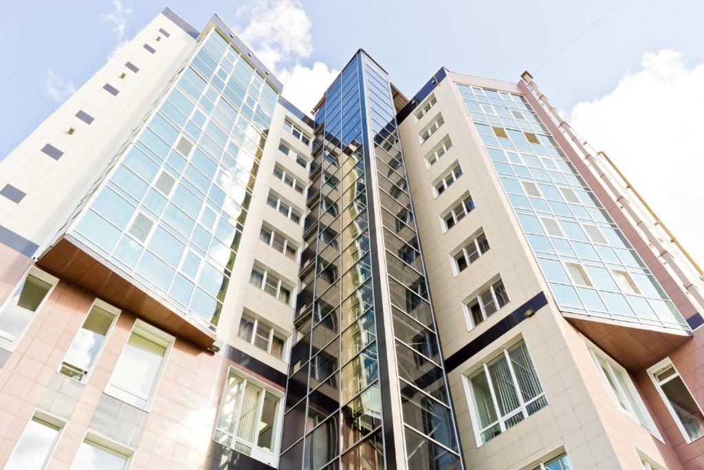 two tall buildings in a city at Pioneer Luxe Hotel in Saratov