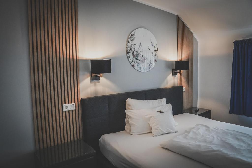 Postel nebo postele na pokoji v ubytování Hotel-Restaurant Osterather Hof