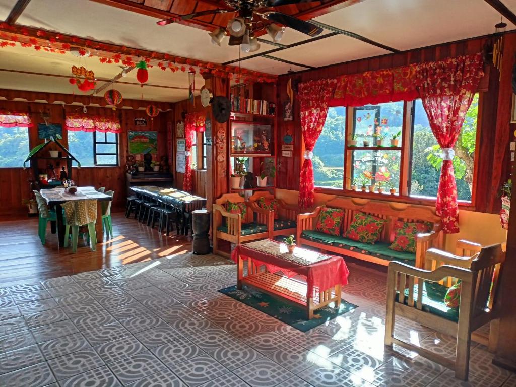 a living room with a couch and a table at Las vegas lodge and restaurant in Banaue