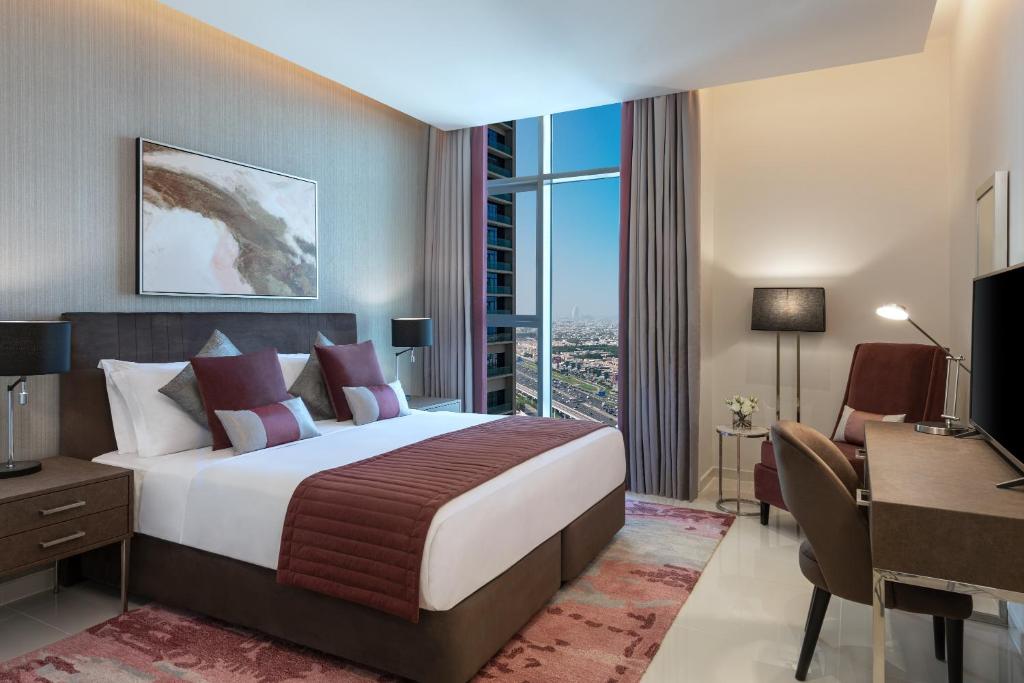 DAMAC Maison Aykon City Dubai客房内的一张或多张床位