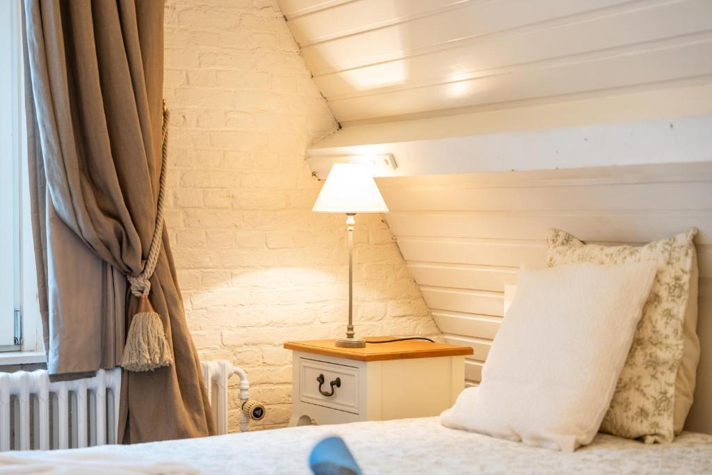 Postel nebo postele na pokoji v ubytování Het Geerwijn - gastensuite in hartje Brugge