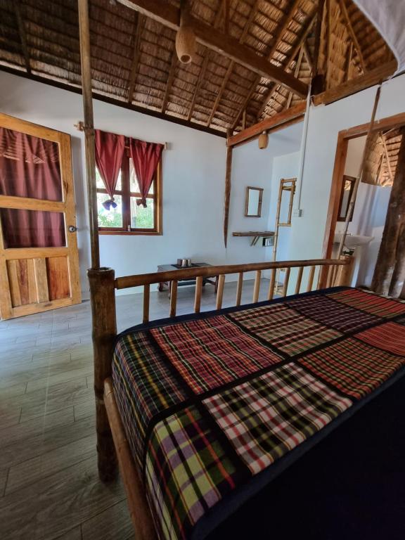 Postel nebo postele na pokoji v ubytování SunBoo Beach Bungalows