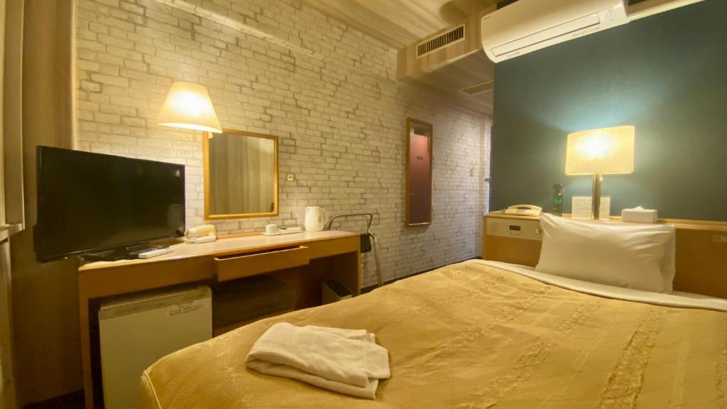 Postel nebo postele na pokoji v ubytování Hotel Select Inn Isehara