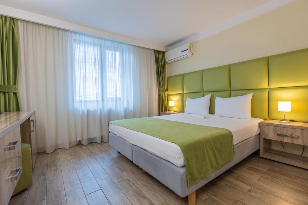 Postel nebo postele na pokoji v ubytování Hotel Corvaris