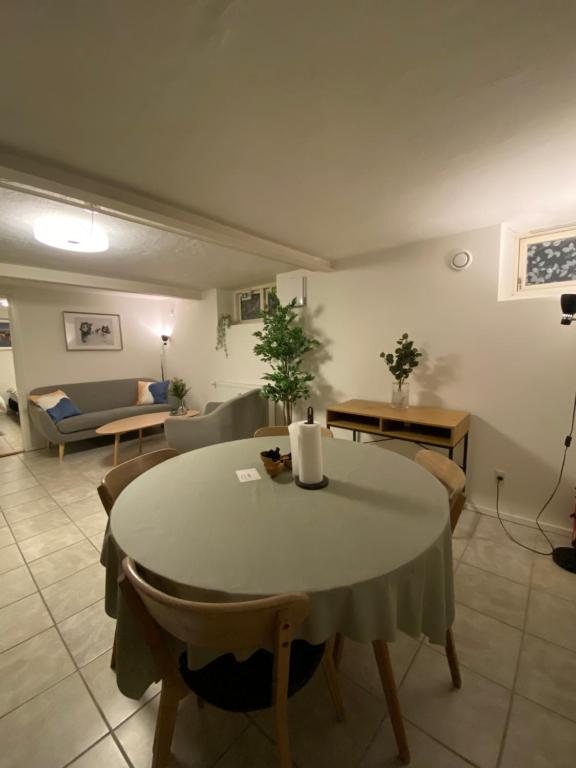 a living room with a table and a couch at Nice apartment in Odense in Odense
