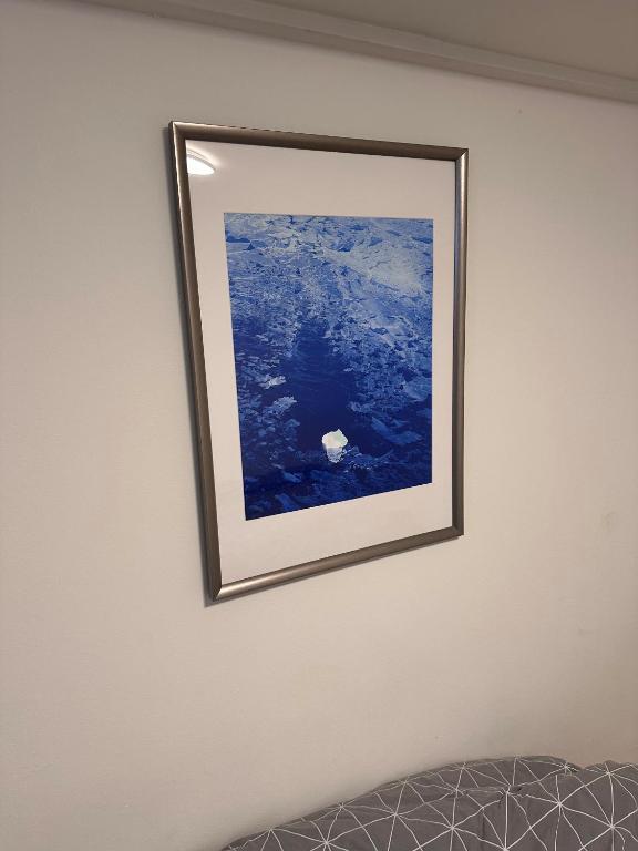 a picture hanging on a wall in a room at Nice apartment in Odense in Odense