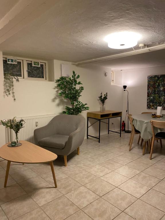 a living room with a couch and a table at Nice apartment in Odense in Odense