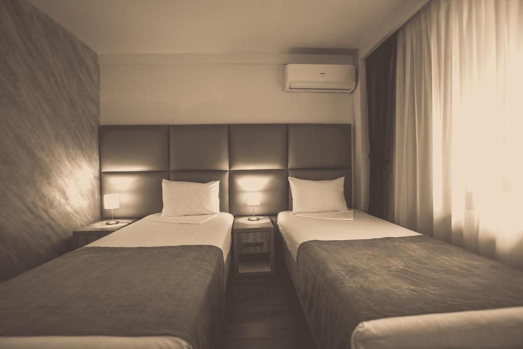 Postel nebo postele na pokoji v ubytování Hotel Corvaris