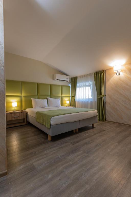 Postel nebo postele na pokoji v ubytování Hotel Corvaris