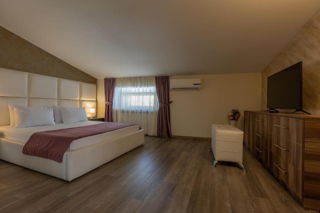 Postel nebo postele na pokoji v ubytování Hotel Corvaris