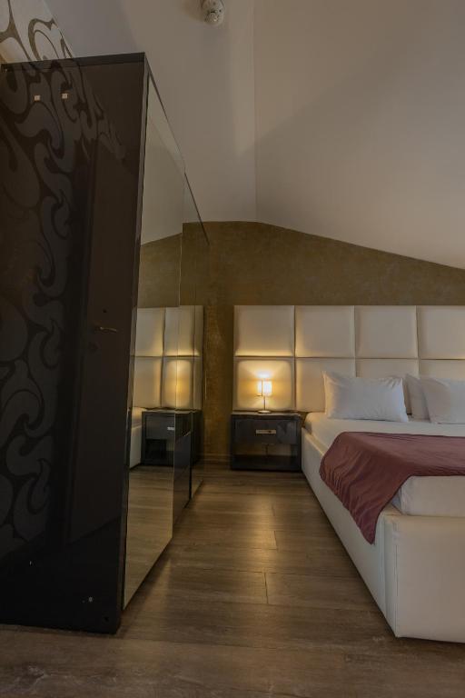 Postel nebo postele na pokoji v ubytování Hotel Corvaris