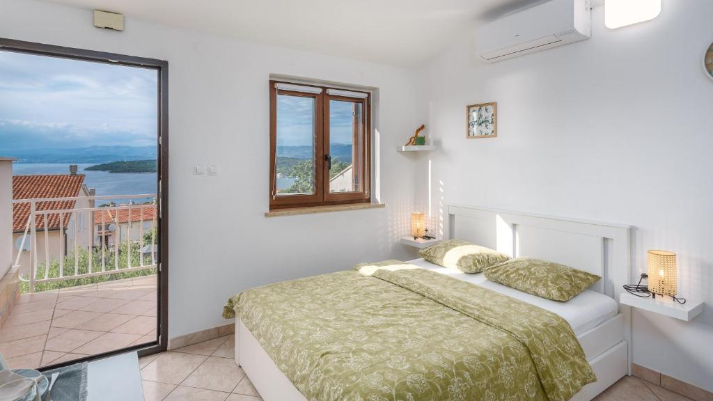Posteľ alebo postele v izbe v ubytovaní Apartment Karabaic by El-Pi Tours