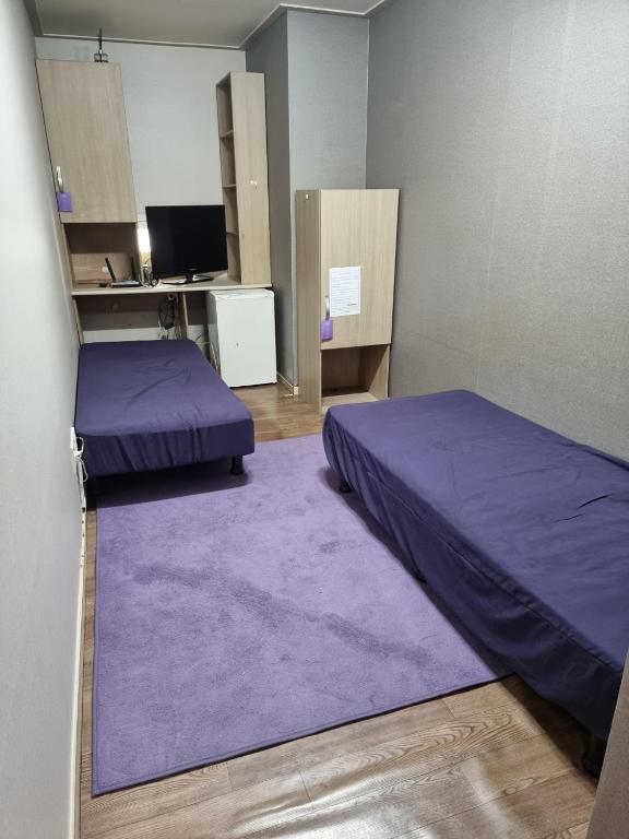 Postel nebo postele na pokoji v ubytování Halla Livingtel