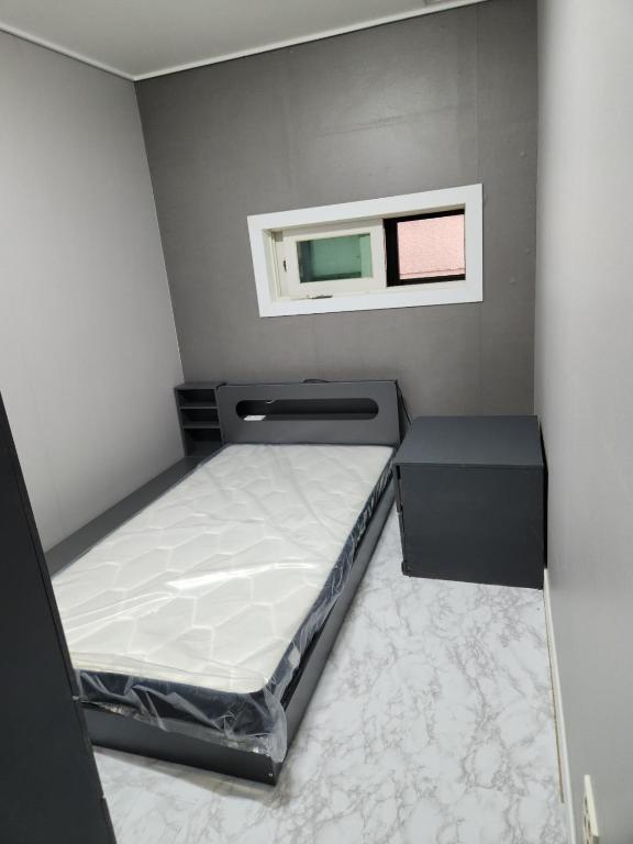 Postel nebo postele na pokoji v ubytování Halla Livingtel