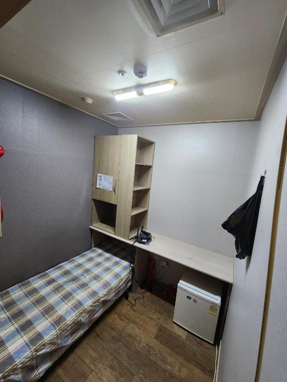 Postel nebo postele na pokoji v ubytování Halla Livingtel