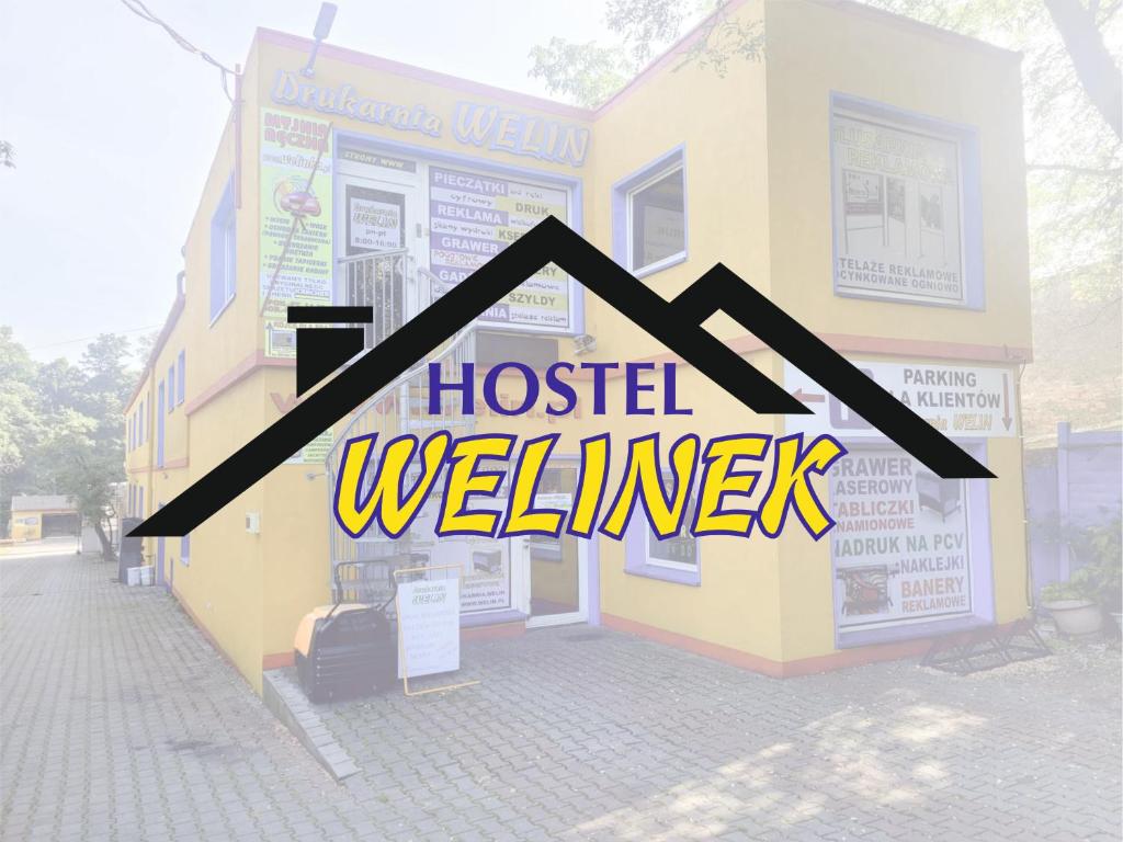 a house with the words hostelwelines written on it at Hostel WELINEK gratis parking in Stęszew