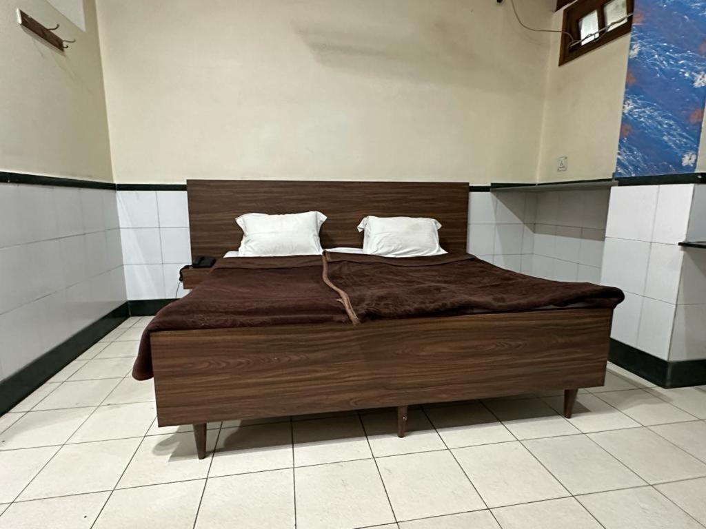 Postel nebo postele na pokoji v ubytování New Royal Hotel