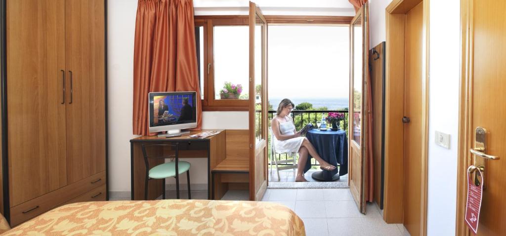 TV a/nebo společenská místnost v ubytování Hotel Da Fine