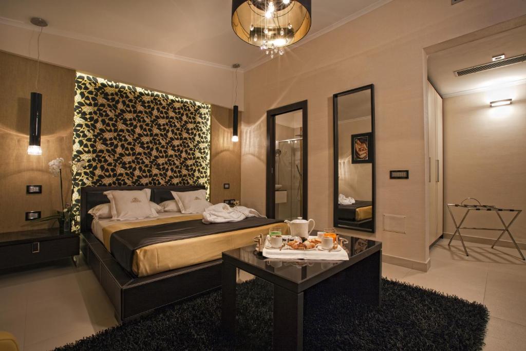 Säng eller sängar i ett rum på Hotel Cenacolo