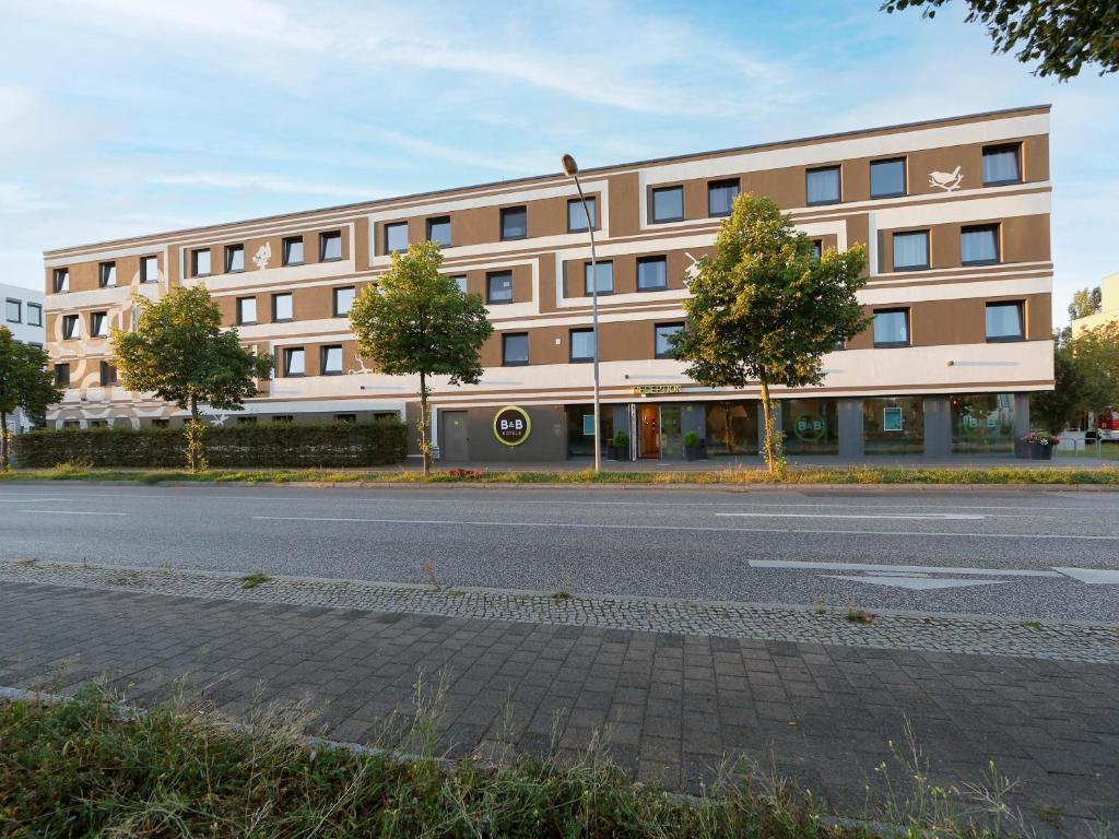 a large building on the side of a street at B&B Hotel Potsdam in Potsdam