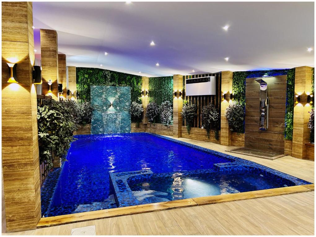 a large swimming pool in a hotel room at Villa Almedina Spa in Vlasic