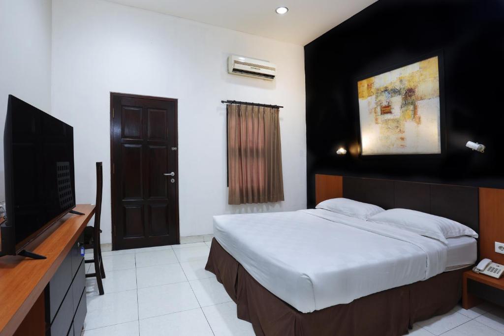 TV a/nebo společenská místnost v ubytování Jambuluwuk Residence Menteng