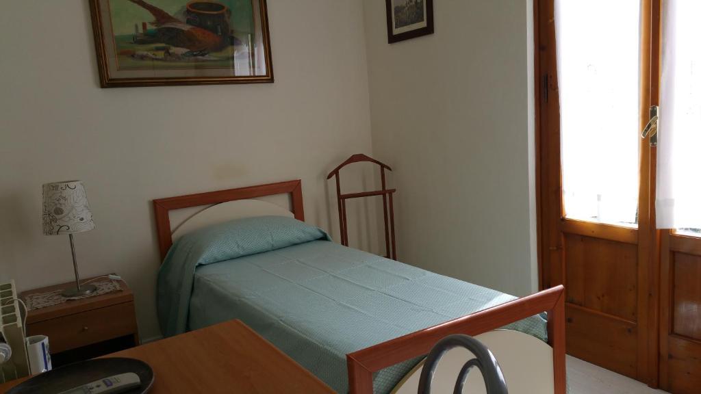 Postel nebo postele na pokoji v ubytování Hotel Redi