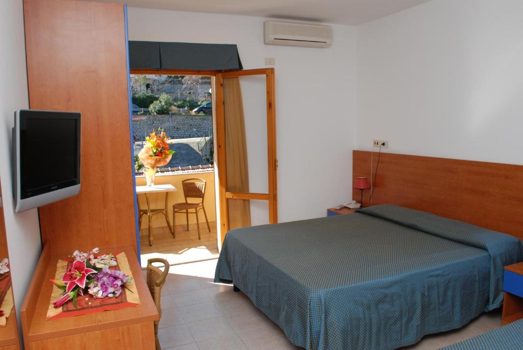 Postel nebo postele na pokoji v ubytování Hotel Da Fine
