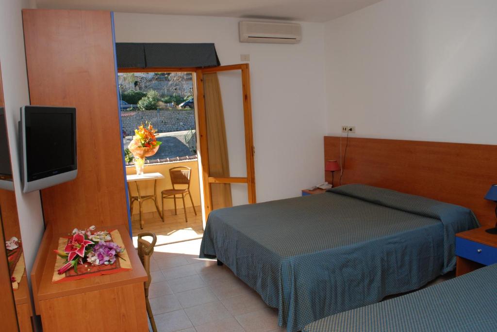 Postel nebo postele na pokoji v ubytování Hotel Da Fine