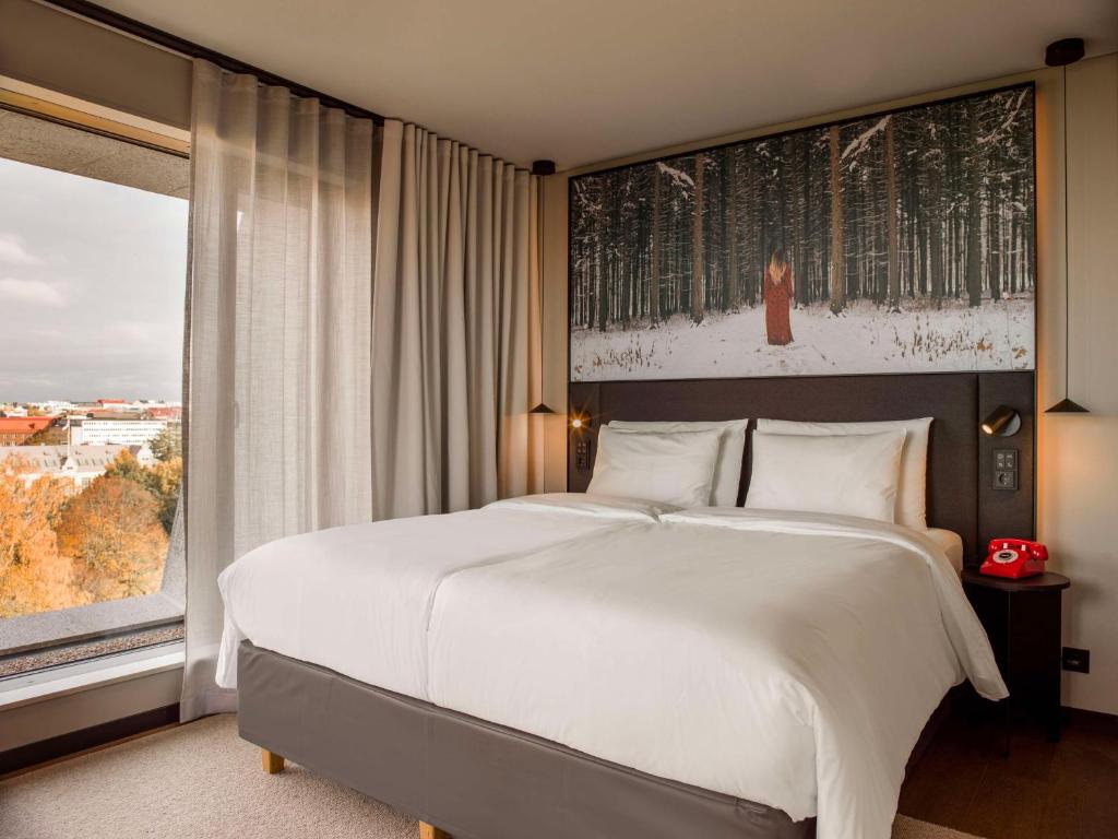 Ένα ή περισσότερα κρεβάτια σε δωμάτιο στο Radisson RED Helsinki