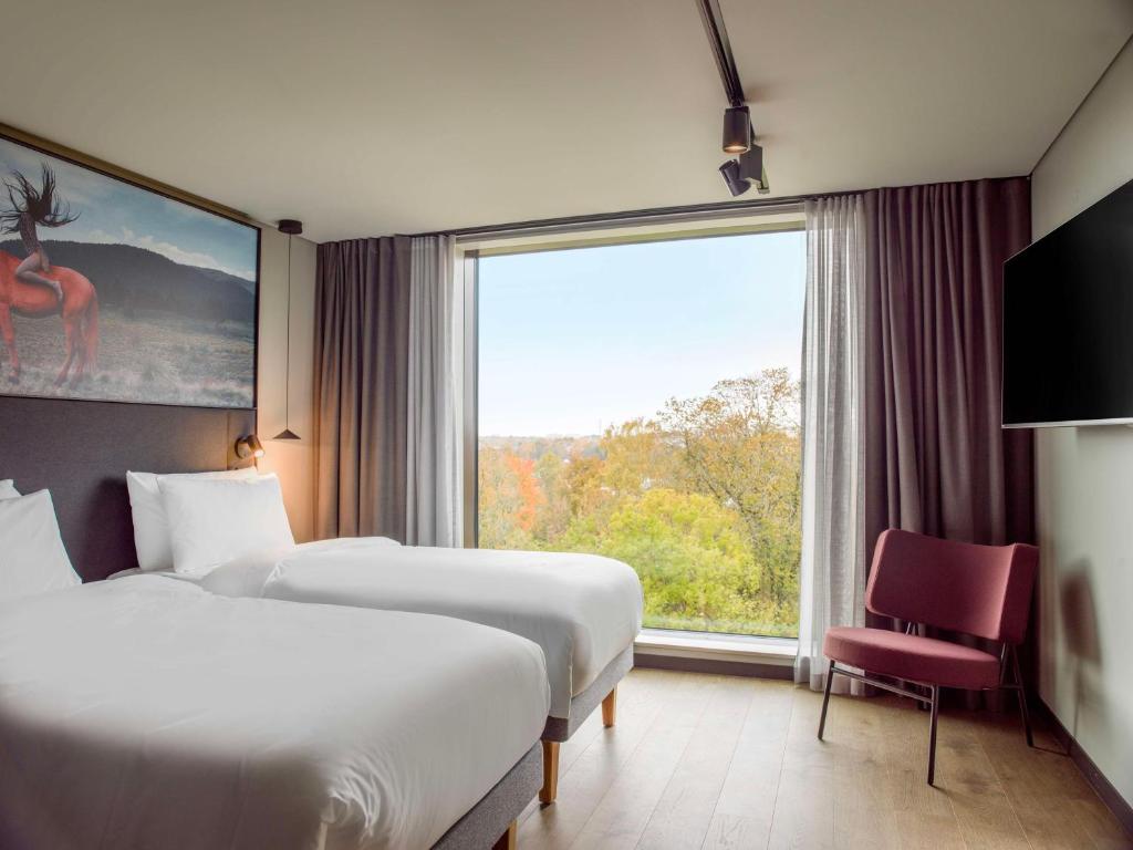 Ένα ή περισσότερα κρεβάτια σε δωμάτιο στο Radisson RED Helsinki
