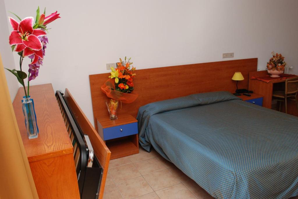 Postel nebo postele na pokoji v ubytování Hotel Da Fine