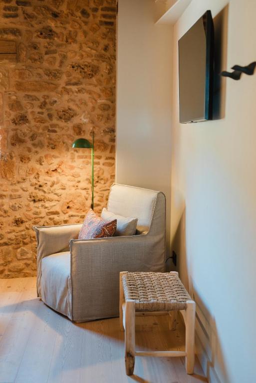 a living room with a couch and a table at Hotel-Masia Can Farrés in El Bruc