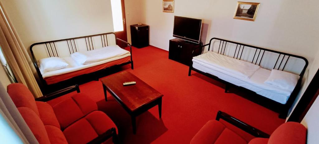Postel nebo postele na pokoji v ubytování Hotel Baroko