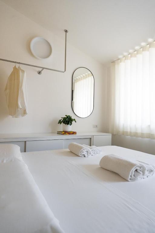 Postel nebo postele na pokoji v ubytování VIVO Rooms