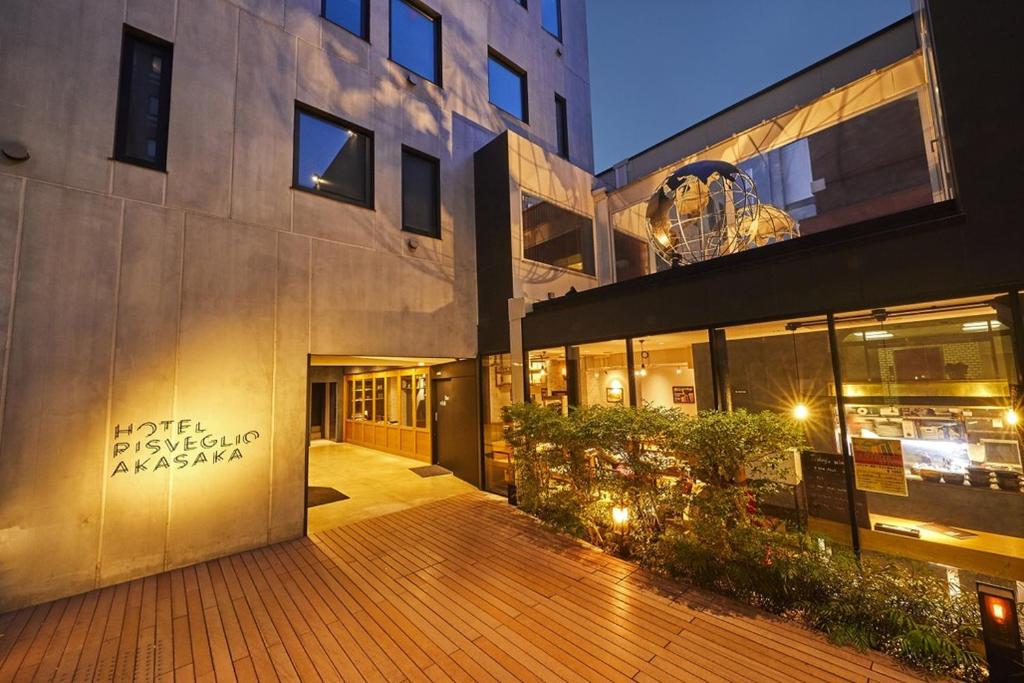 a building with a sign on the side of it at Hotel Risveglio Akasaka in Tokyo