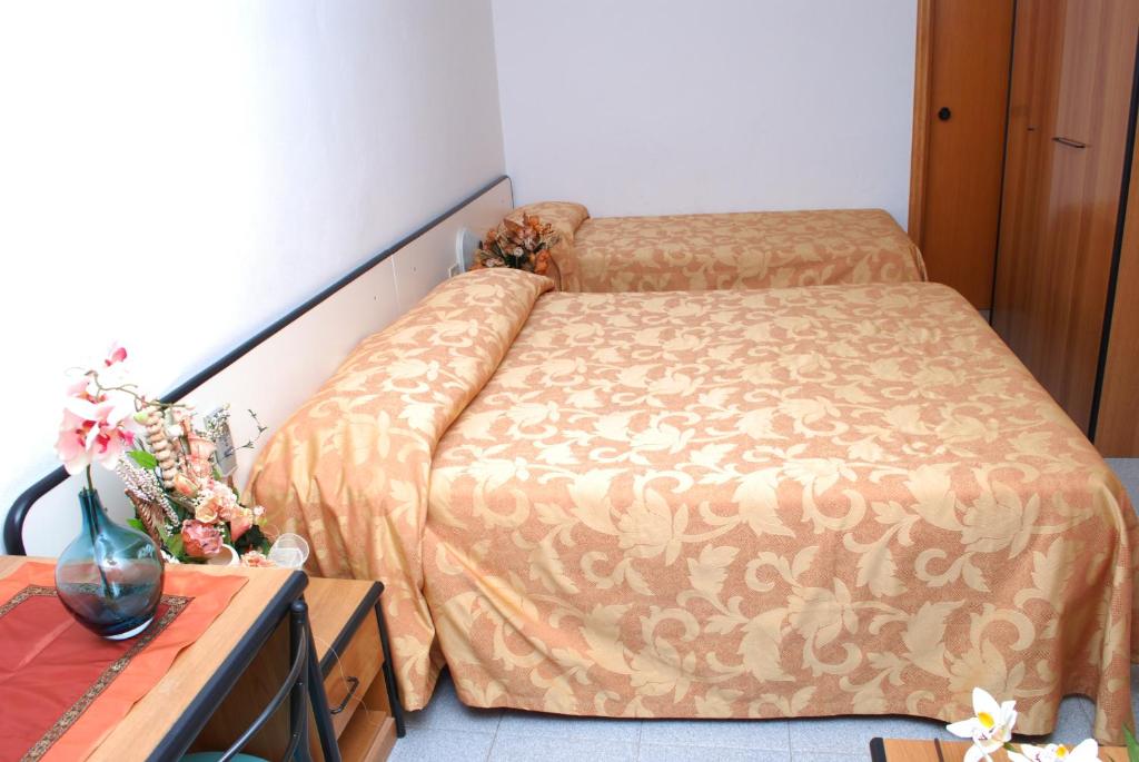 Postel nebo postele na pokoji v ubytování Hotel Da Fine