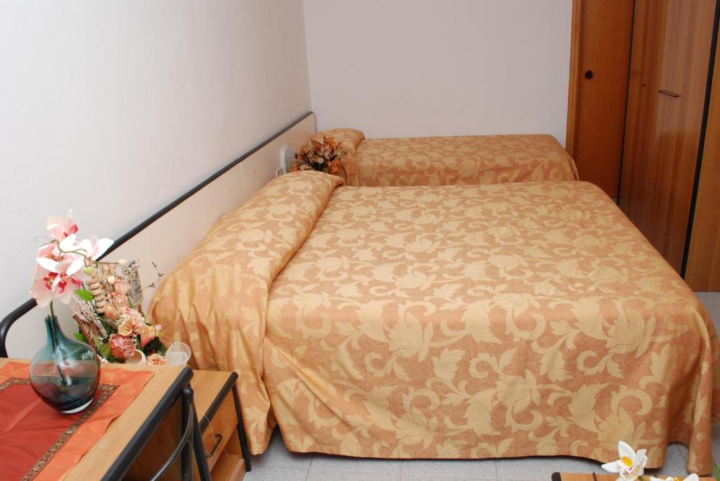 Postel nebo postele na pokoji v ubytování Hotel Da Fine