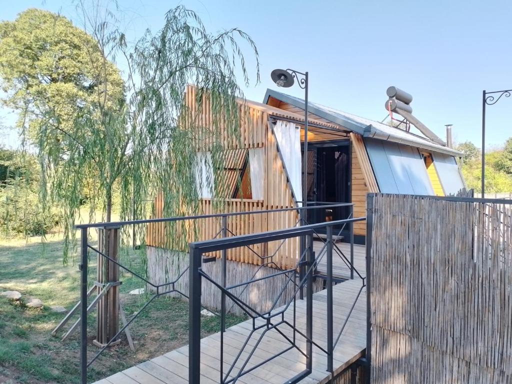a house with a gate and a fence at Glamping House Two Rivers in Ljubuški